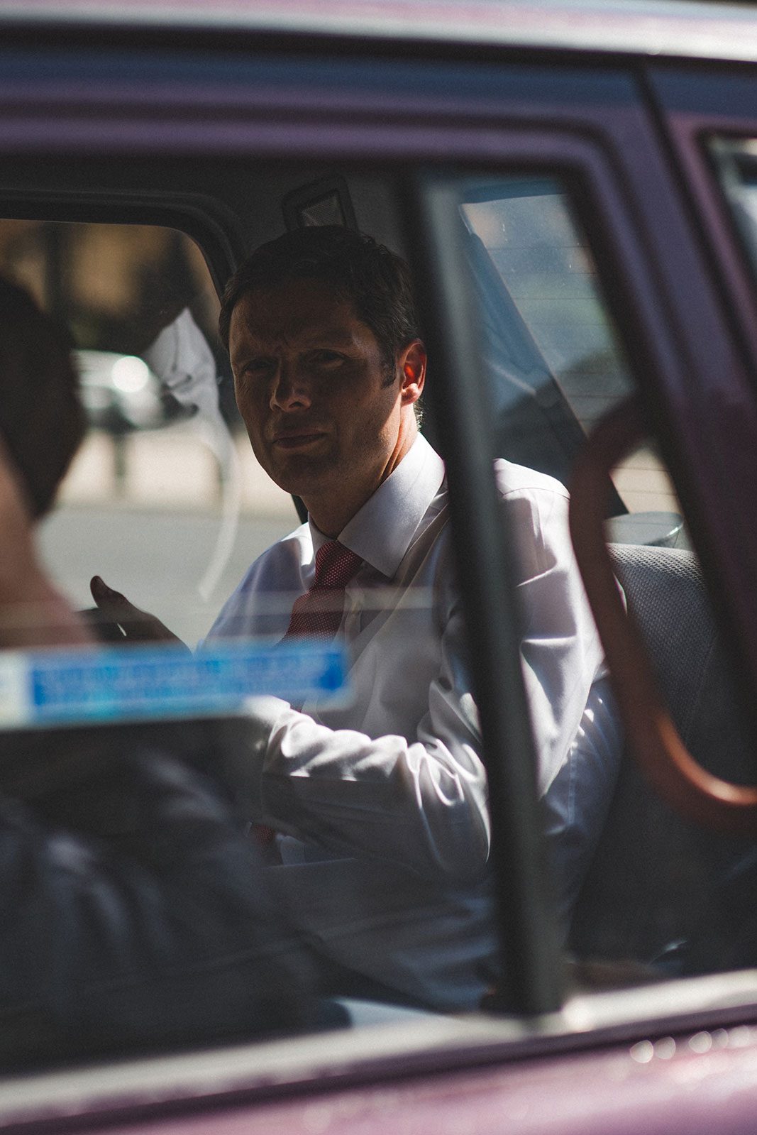 An Australian business man in a taxi cab