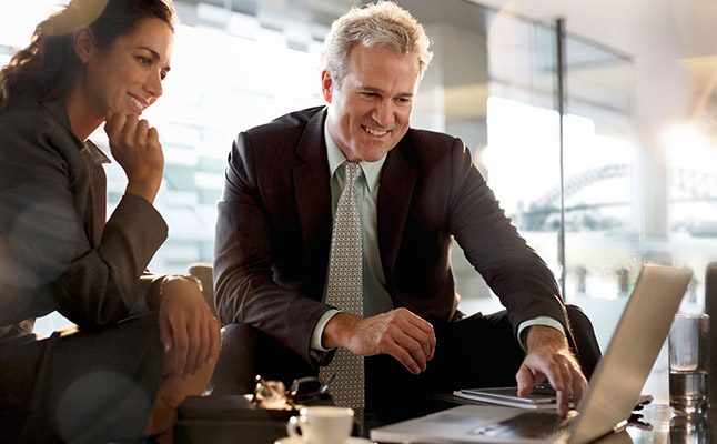 Professionals in Sydney office discussing a business case