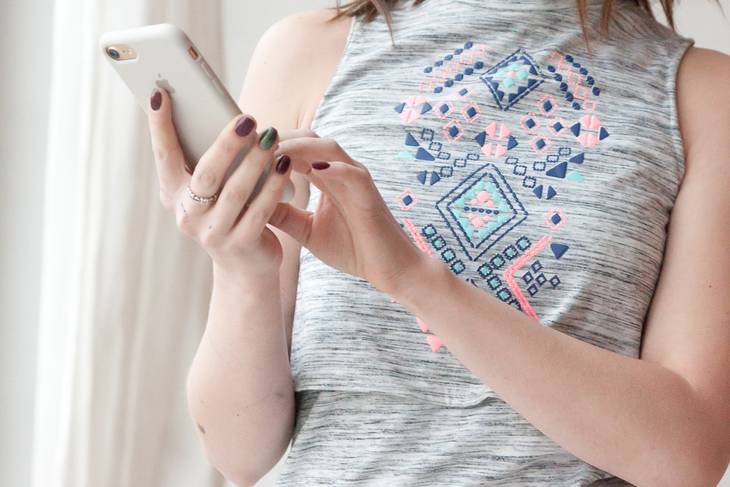 A woman using her mobile phone to make contact